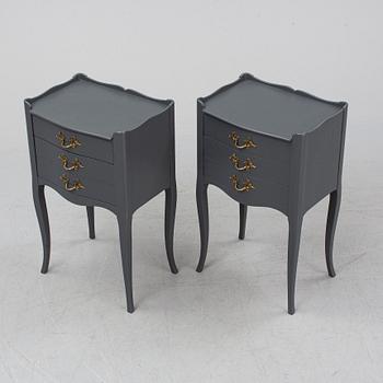 A pair of rococo style bedside tables.