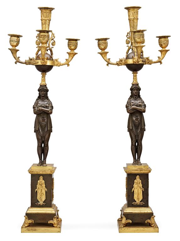 A pair of French Empire early 19th century four-light candelabra.