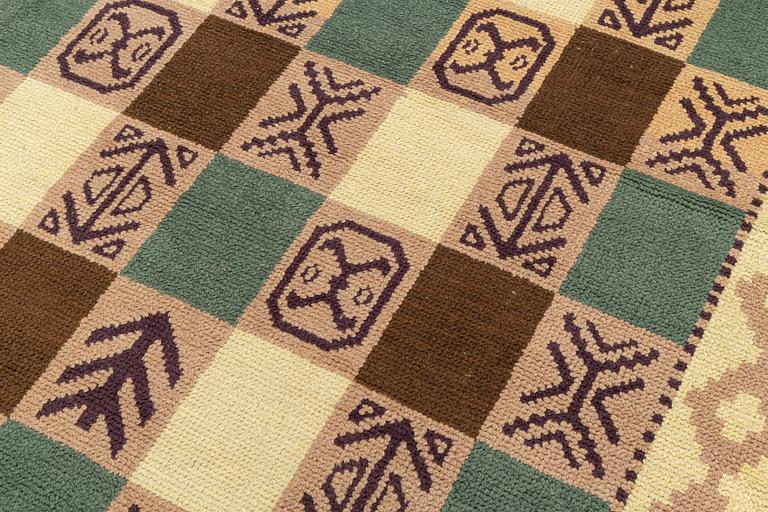 A Swedish knotted pile carpet, c 243 x 175 cm.