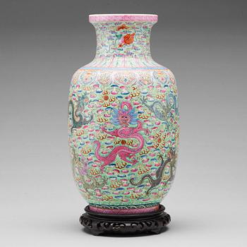 695. A famille rose and green ground vase, Republic (1912-49), with Qianlong six character mark.