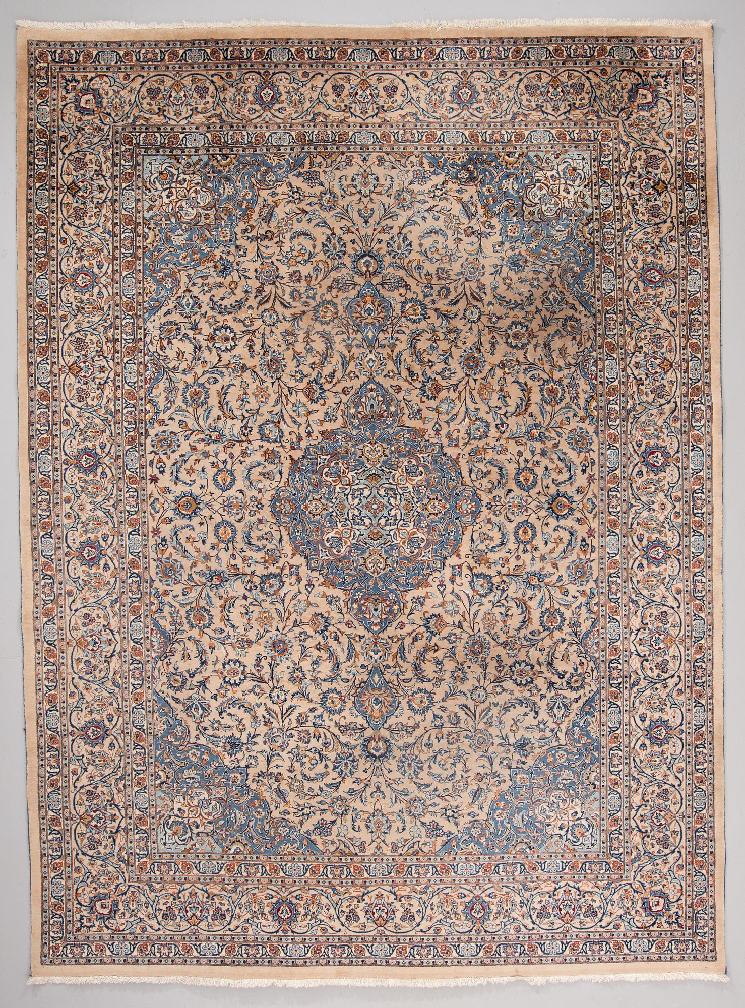 A carpet from Mashad, around 381 x 297 cm.