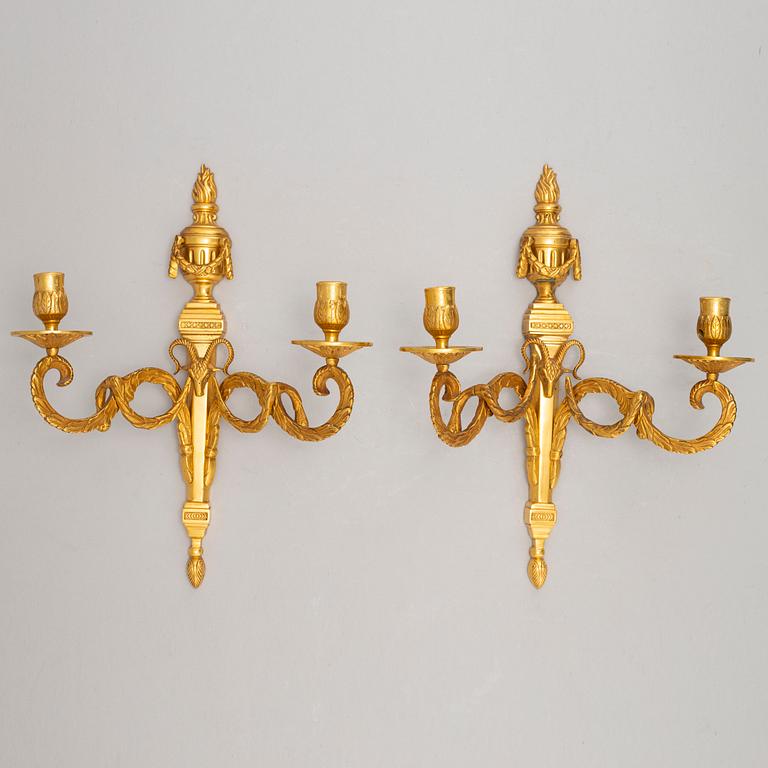 A pair of wall sconces, Louis XVI style, early 20th century.