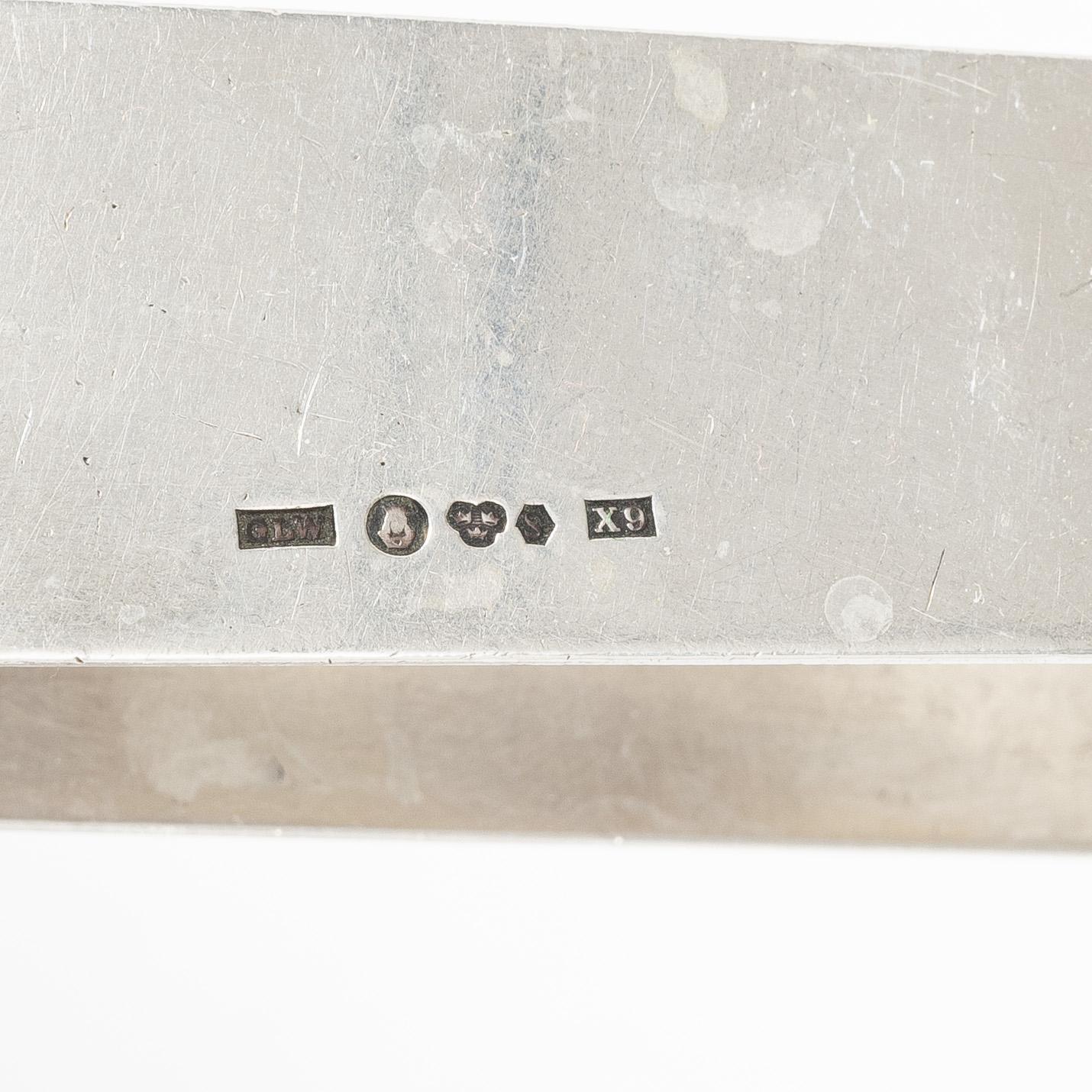 Four silver objects, 20th Century.