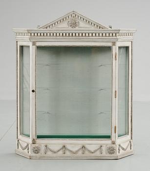 74. A Louis XVI-style vitrine, 20th century.