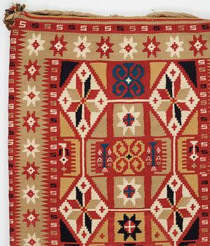 A carriage cushion, double-interlocked tapestry, ca 96-99 x 47-49,5 cm, Scania around 1834, Sweden,