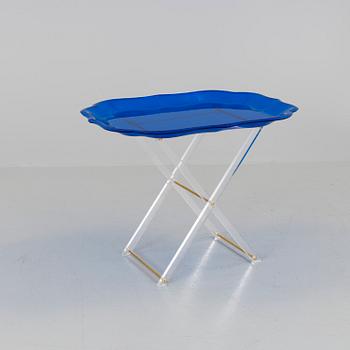 A plastic tray table, probably from Spisani, Italy.