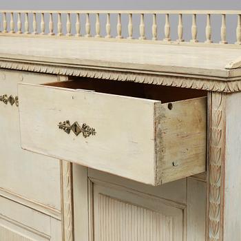 An early 19th Century painted late Gustavian cupboard.