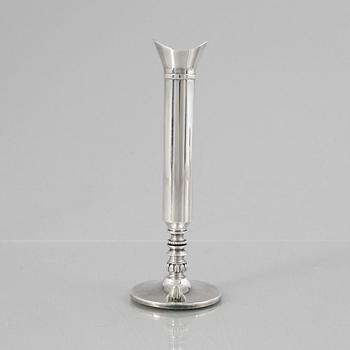 Eric Löfman, a Swedish silver candlestick, a vase and four cups, including MGAB, Uppsala 1977.
