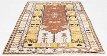 A semi-antique anatol rug, c. 208 x 114 cm.