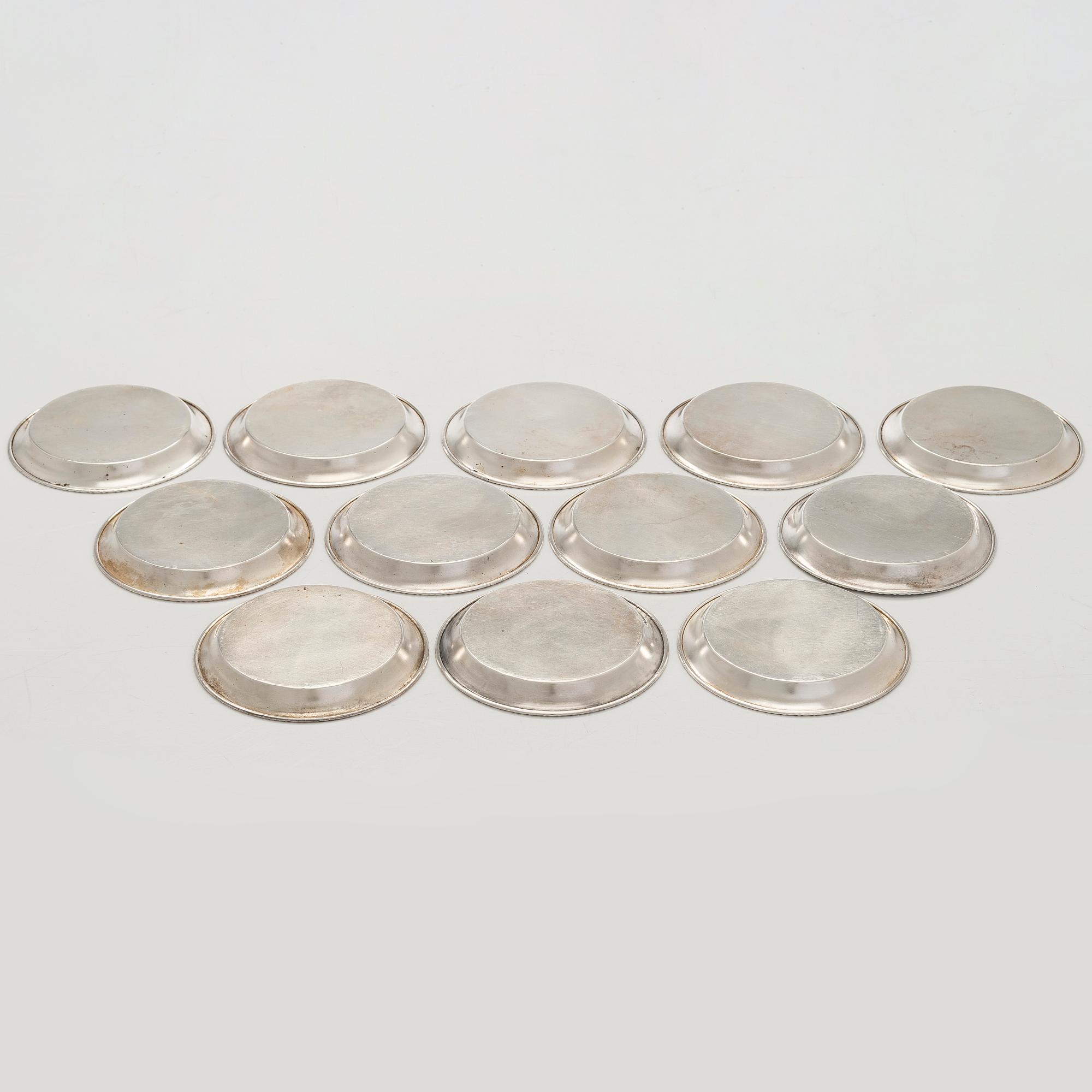 A 12-piece set of silver glass coasters, Kultakeskus, Hämeenlinna 1952. In original fitted case.