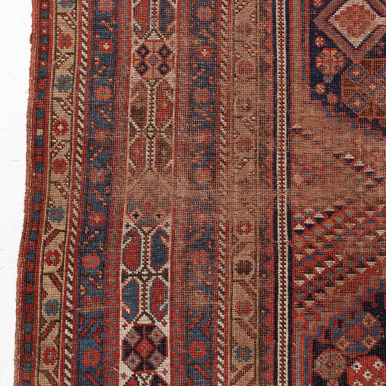 An antique Khamseh carpet, South western Iran, c 352 x 178 cm.