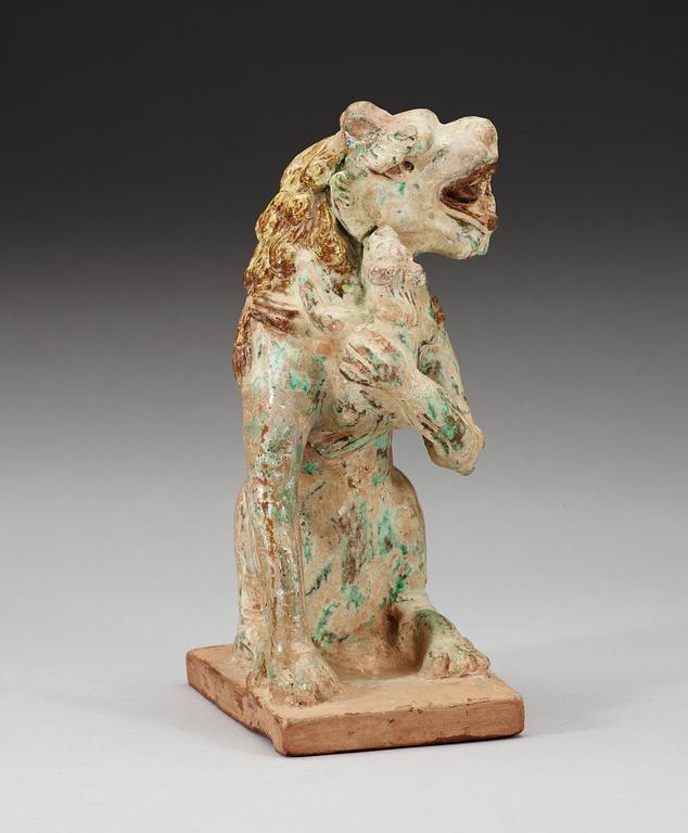 A green and yellow glazed lion with a cub, Song dynasty (960-1279).