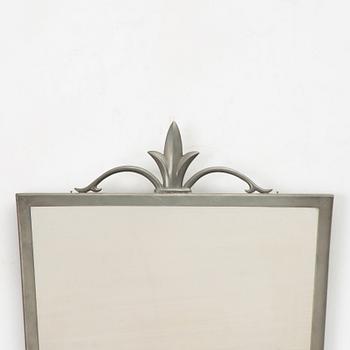 A mirror and pair of wall sconces, Sweden, 1932.