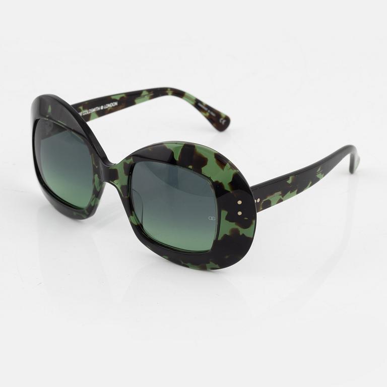 Oliver Goldsmith, a pair of green "Uuksu" sunglasses.