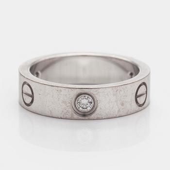 Cartier, sormus, "Love", 18K valkokultaa ja kolme briljanttihiottua timanttia.