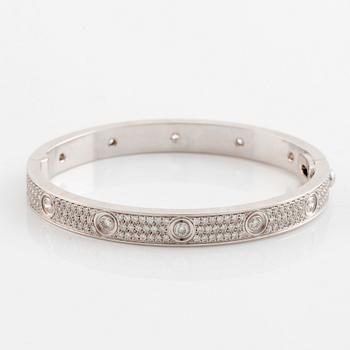 A Cartier "Love" bracelet in 18K white gold set with round brilliant-cut diamonds.