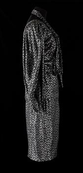 An ensemble consisting of skirt, top, belt and scarf by Christian Dior.