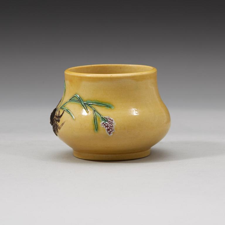 A yellow brush pot, Qing dynasty with Daoguang mark and period (1821-1850).