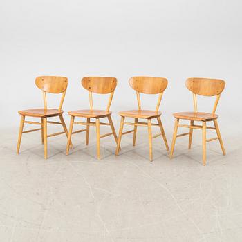 A set of four birch and teak veneered chairs from Bröderna Wigells stolfabrik, Malmbäck mid 20th century.