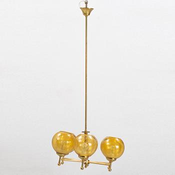 A six-light brass ceiling light, later part of the 20th Century.