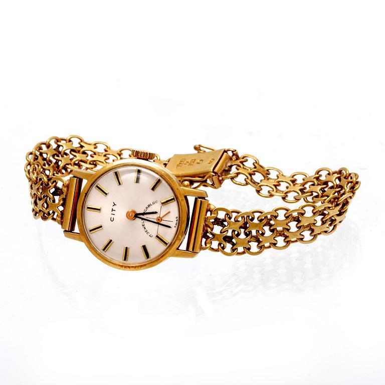 An 18K gold City wristwatch.