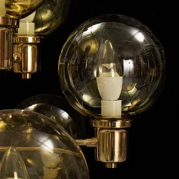 A 1960's brass and glass ceiling light.