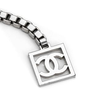 CHANEL, a chain belt.