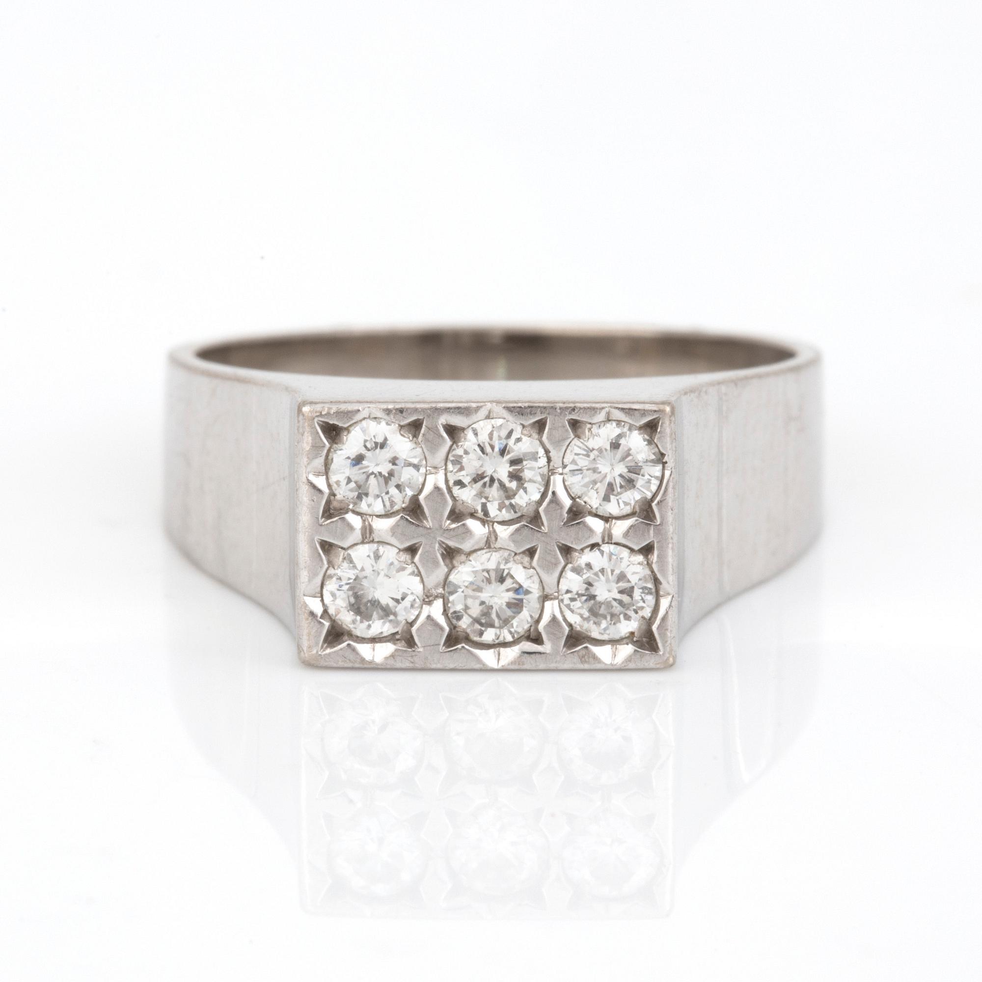 RING. 18 k vitguld. 6 x ca 0,06 ct, 1/81. Totalvikt ca 6 g.