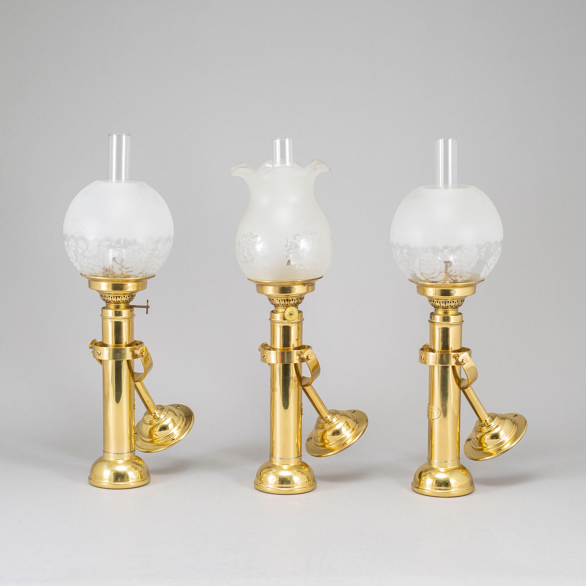 A set of three brass kerosene lamps GV Harnisch Denmark later part of the 20th century.