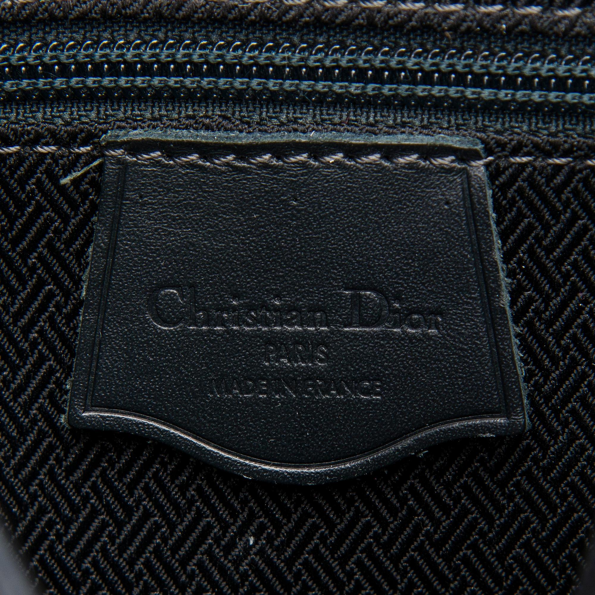A Dior Canvas Crossbody Bag.