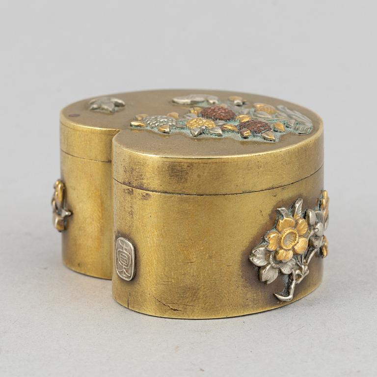 A lidded heart shaped brass box with cover, Meiji period (1868-1912), around the year 1900.