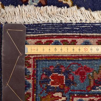 An oriental carpet, c. 390 x 295 cm.