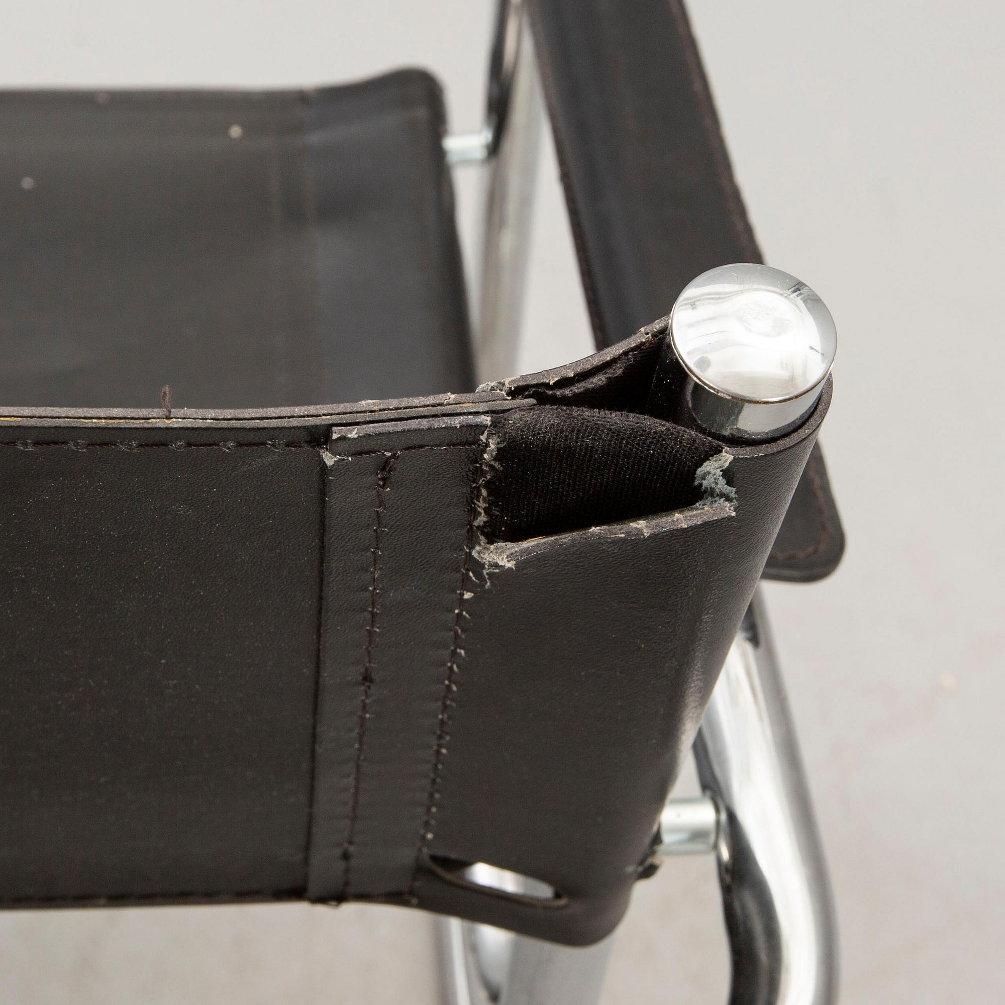 A set of five similar Italian 1970s chrome and leather armchairs.