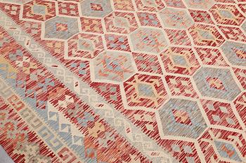 A Kilim carpet, approx. 379 x 313 cm.