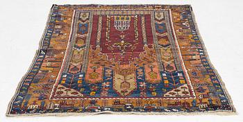 An antique rug, possibly Anatolian, approx. 170 x 102 cm.