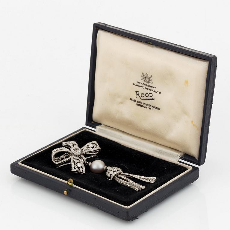 A platinum bow brooch set with old-cut diamonds with a detachable pearl and platinum pendant.