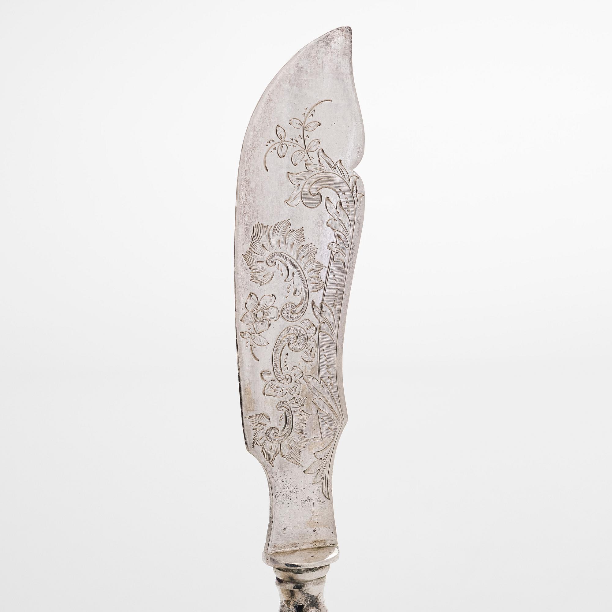 A 12-piece set of parcel-gilt fruit cutlery, and a silver butter knife, maker's mark Iisakki Saha, Pori 1898-1899.