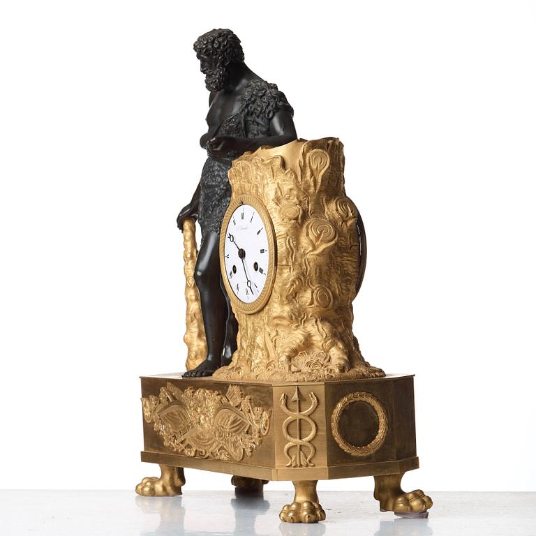 An Empire early 19th Century gilt and patinated bronze mantel clock marked by Devaulx a Paris.