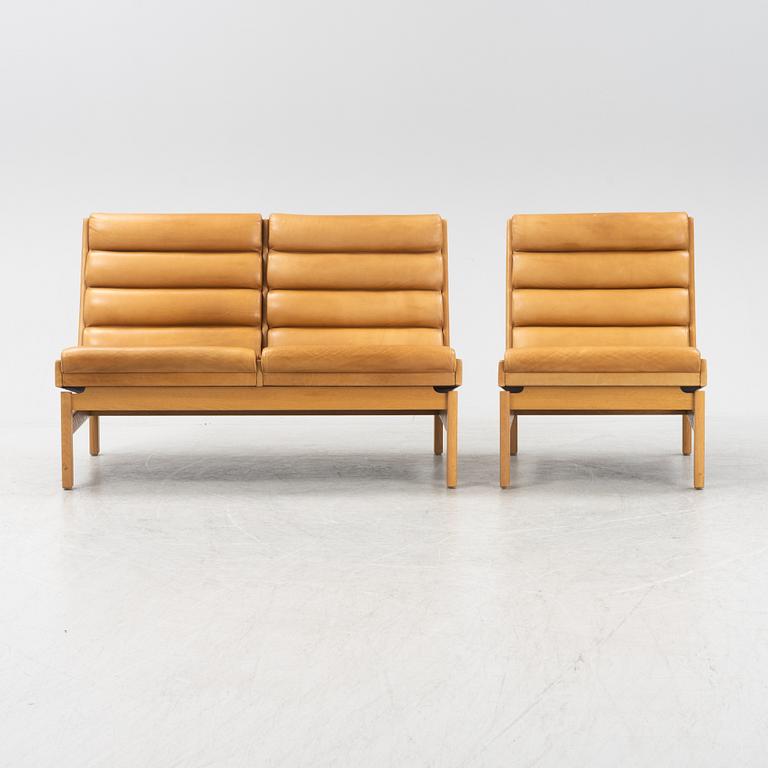 Karl Erik Ekselius, a leather upholstered sofa and an armchair, JOC Möbler, Vetlanda, dated 1969.