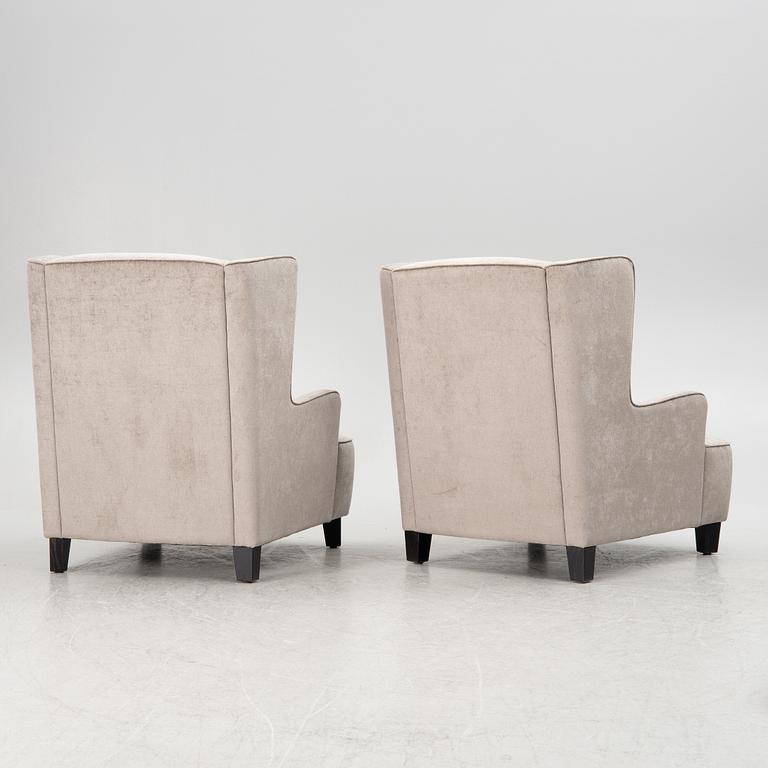 A pair of easy chairs, 21st century.