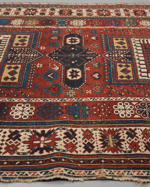 A CARPET, an antique Shirvan, Czar Russia, ca 277-288,5 x 139-140 cm (as well as 1 cm flat weave at the ends).