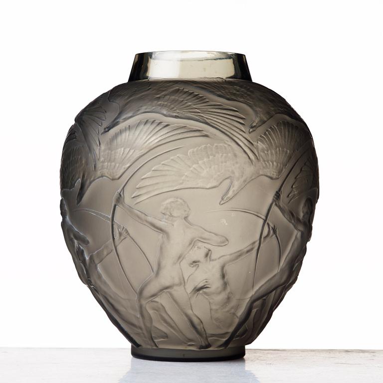 René Lalique, an "Archers" moulded smoke-coloured glass vase, model nr 893, France, post 1921.