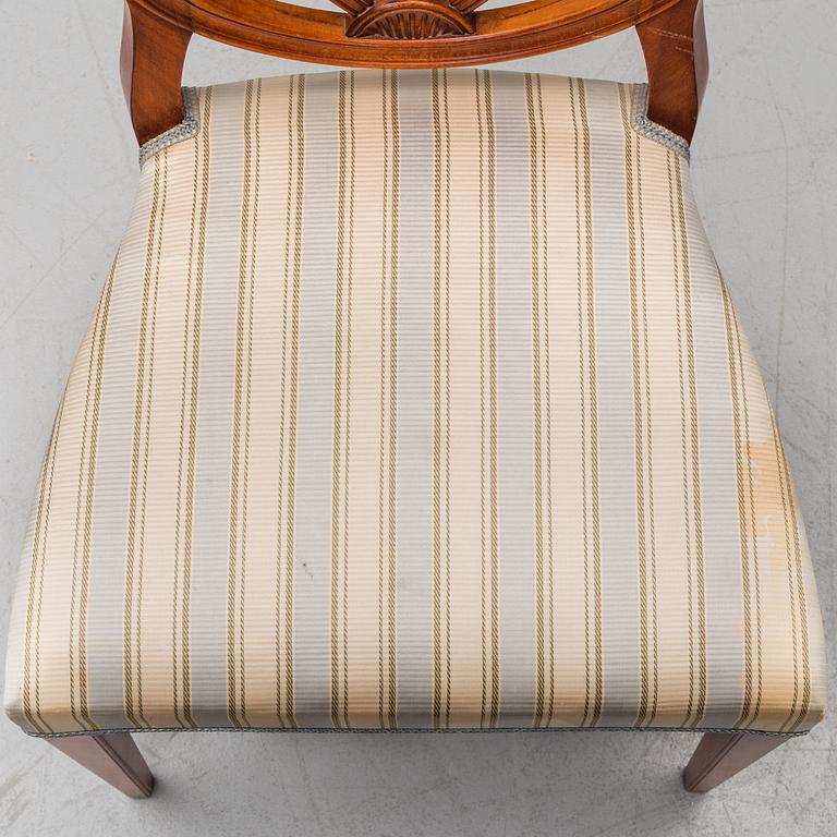 A dining table and 12 chairs, second half of the 20th century.