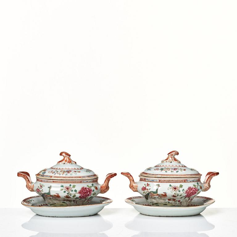 Two famille rose 'double peacock' butter tureens with covers and stands, Qing dynasty, Qianlong (1736-95).