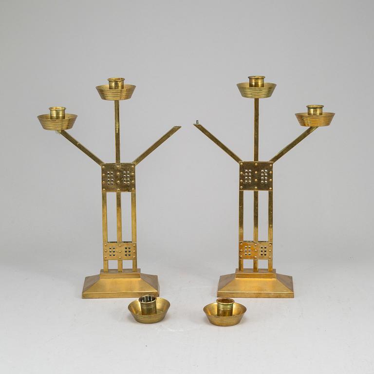 A pair of Art nouveau brass candelabra, early 20th Century.