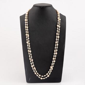 Necklace of two strands of cultured pearls, clasp 18K gold with a hardstone cameo.