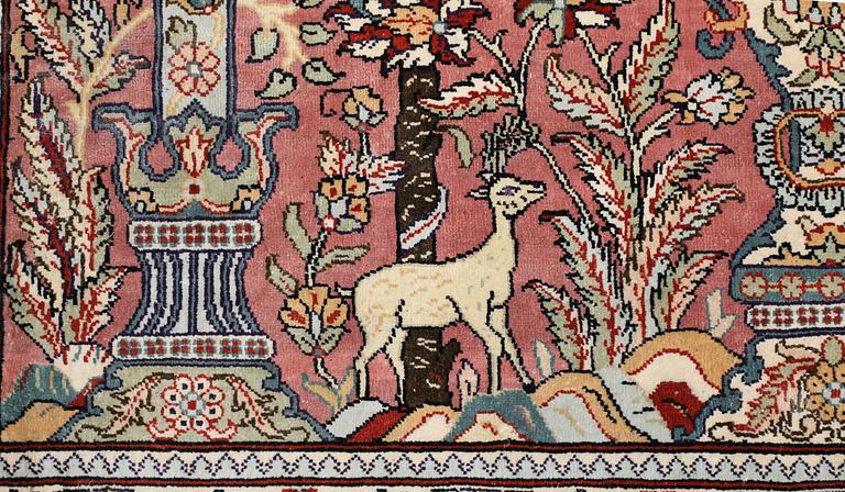 An oriental silk rug, approx. 155 x 93 cm.