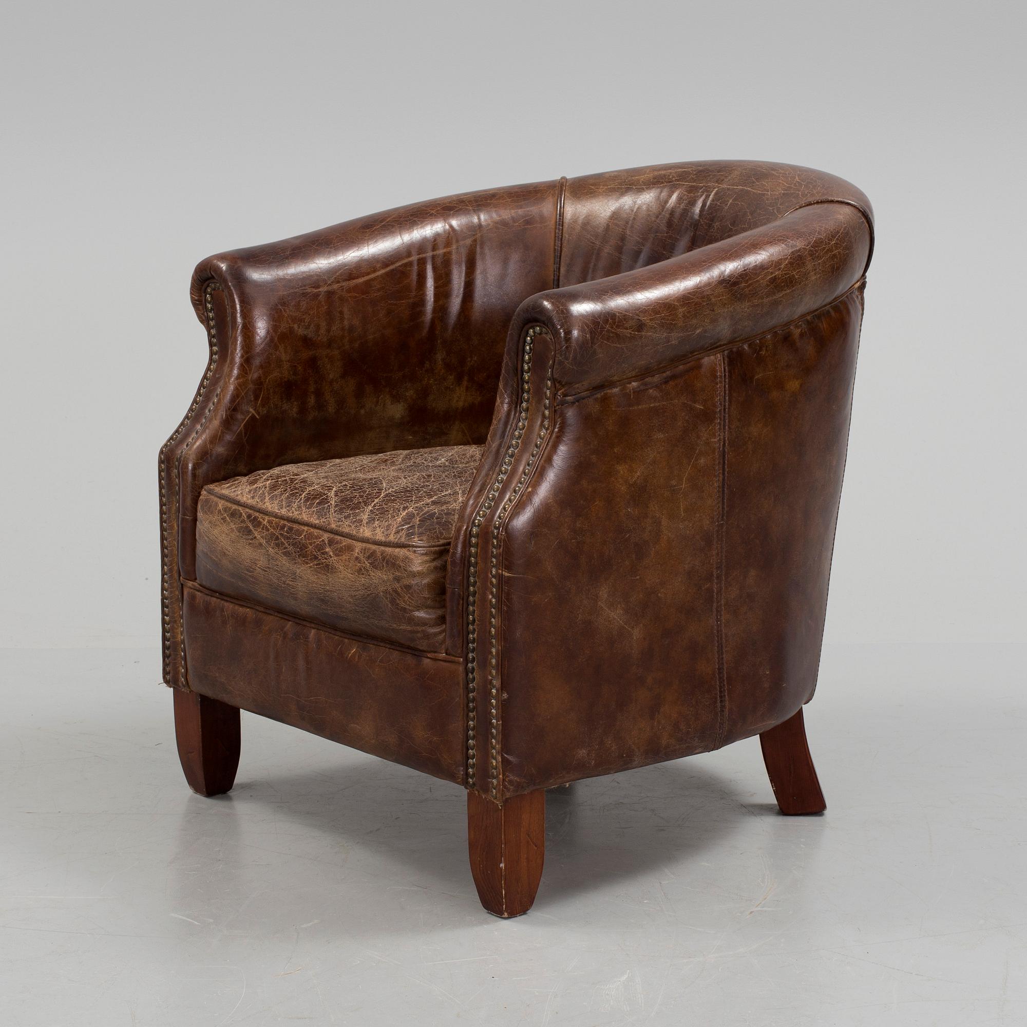 A leather club lounge chair by Newport, ca 2000.