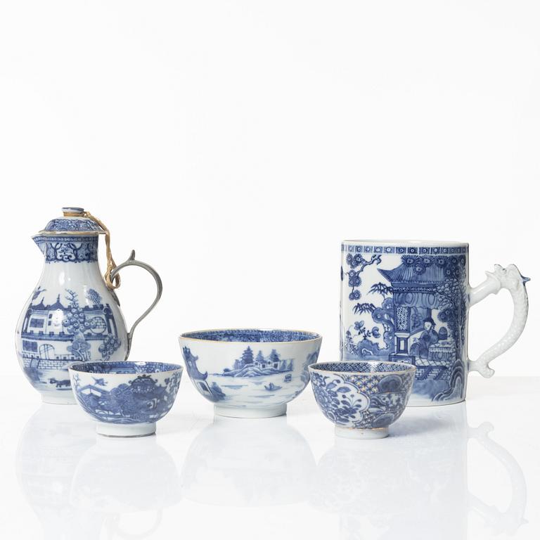A Chinese blue and white jug, an ewer and three cups, Qing dynasty, Qianlong (1736-95).