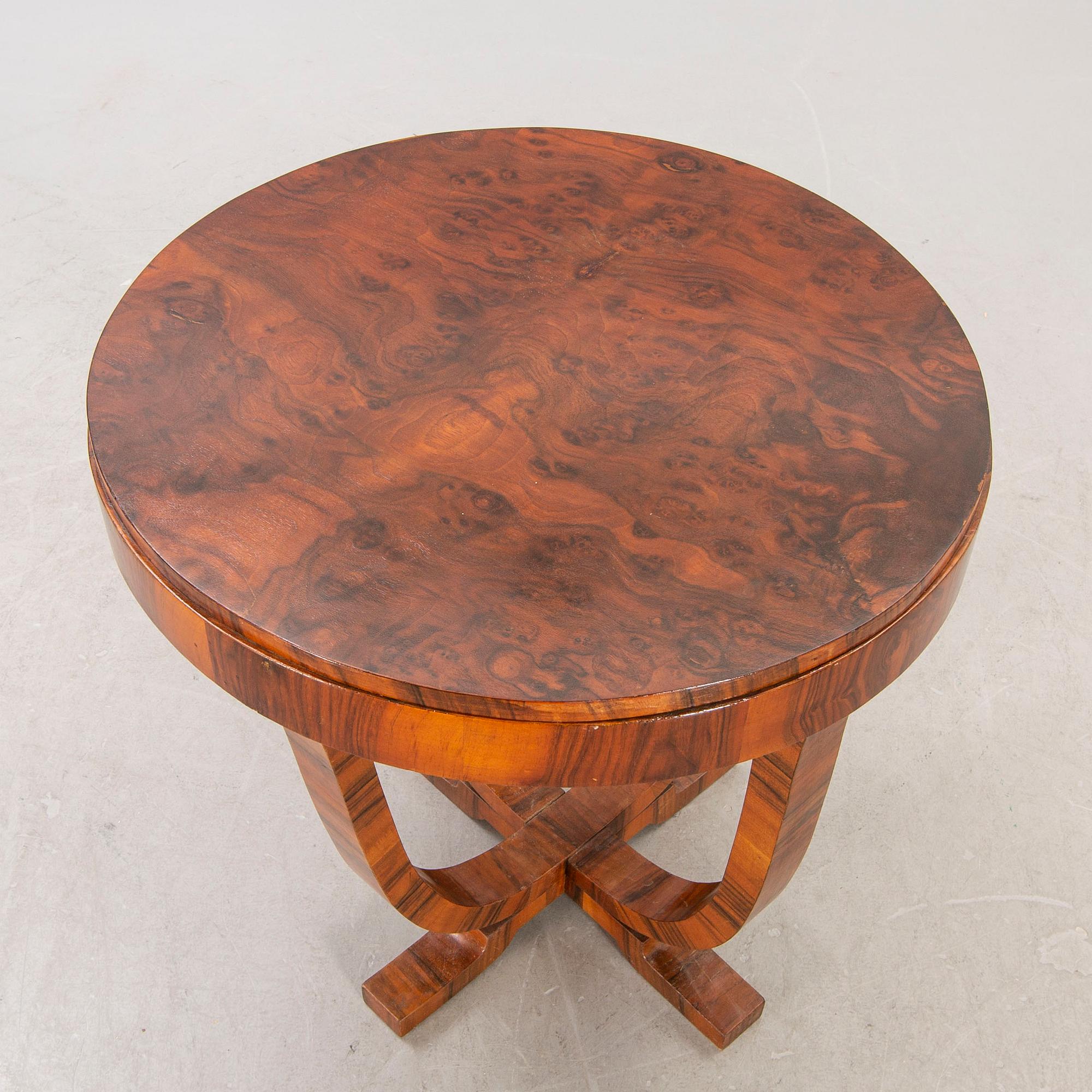 An Art Deco walnut coffee table first half of the 20th century.
